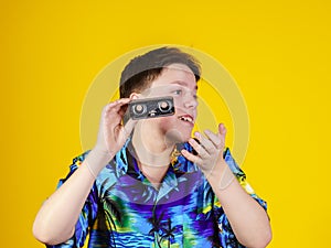 Teenage boy with opera binocular close-up portrait photo