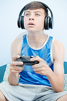 Teenage boy playing a video game