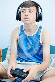 Teenage boy playing a video game