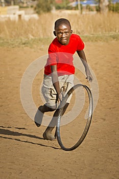 Teenage Boy Playing with Wheel - Head On