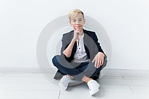 Puberty concept - Teenage boy portrait on a white background.