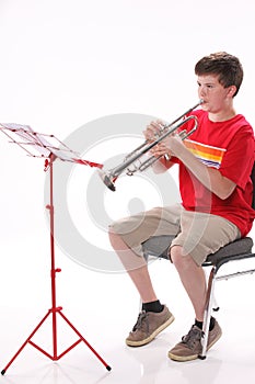 Teenage Boy Practicing Trumpet