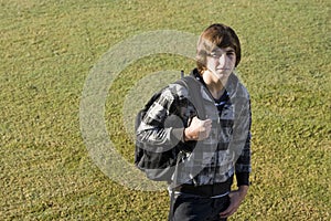 Teenage boy with school backpack