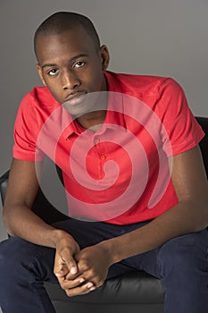 Teenage Boy Seated In Studio