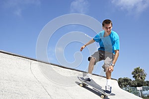 Teenage Boy In Skateboard Park