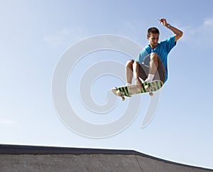 Teenage Boy In Skateboard Park photo