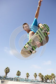 Teenage Boy In Skateboard Park