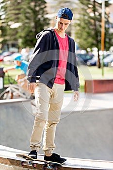 Teenage boy skateboarding outdoors