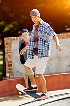 Teenage boy skateboarding outdoors