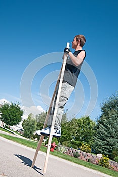 Teenage boy on stilts