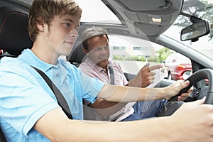 Teenage Boy Taking A Driving Lesson photo