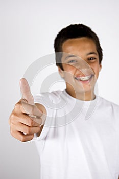 Teenage boy with thumb up