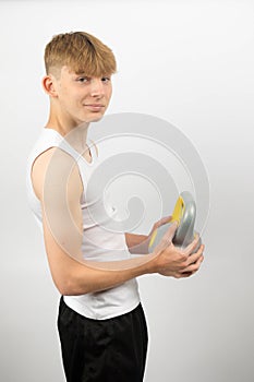 Teenage boy using a kettlebel