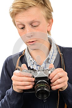 Teenage boy using retro camera