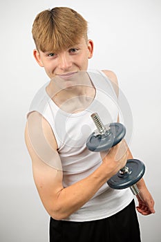 Teenage boy using a sumbbell