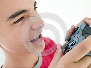 Teenage boy using video game controller