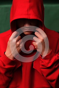 Teenage boy wearing fashionable red hoodie