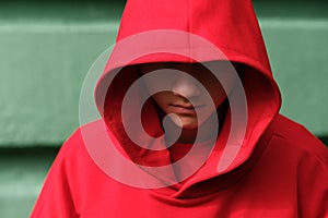 Teenage boy wearing fashionable red hoodie