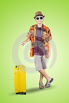 Teenage boy wearing summer clothes on studio