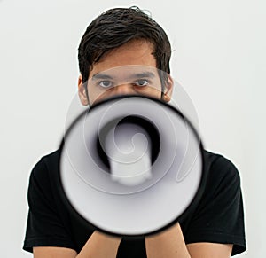 Teenage boy on white background with a megaphone