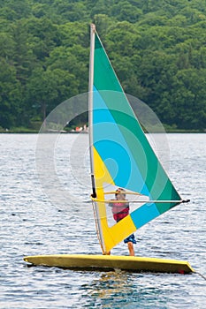 Teenage boy wind surfing