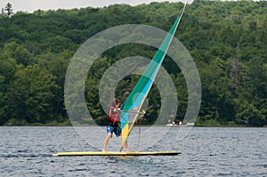 Teenage boy wind surfing