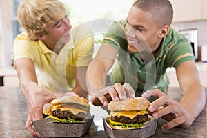 Teenage Boys Eating Burgers