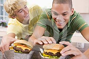 Teenage Boys Eating Burgers