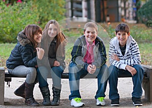 Teenage boys and girls having fun in the park