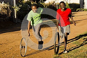 Teenage Boys Playing with Wheel