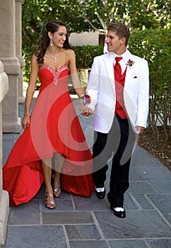 Teenage Couple Going to the Prom Walking and Smiling at Each Other