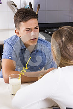 Teenage couple having argument indoors