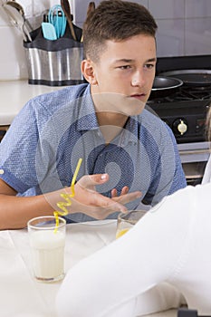 Teenage couple having argument indoors