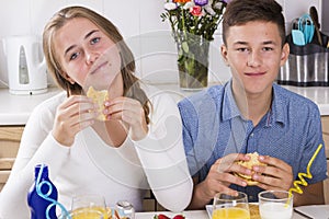 Teenage couple having breakfast together