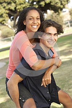 Teenage Couple Having Fun In Playground