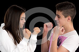 Teenage couple imitating a fight