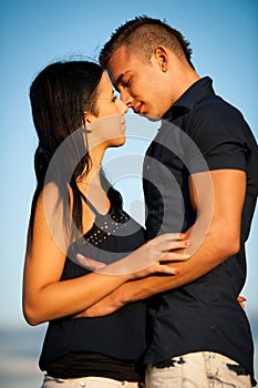 Teenage couple on a late summer afternoon in park