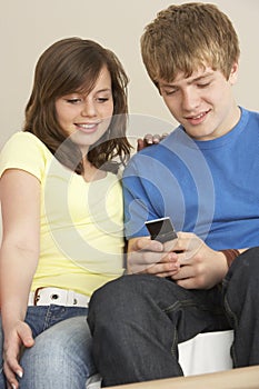 Teenage Couple Reading Text Message