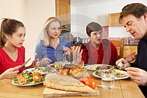 Teenage Family Having Argument Whilst Eating Lunch