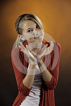 Teenage female girl against orange