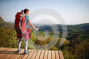 Teenage female hiker watching at distance