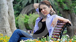 Teenage Female Under Stress Sitting On Bench