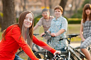 Teenage friends on bicycles