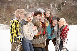 Teenage Friends Having Fun In Snow