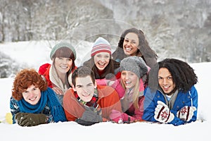 Teenage Friends Having Fun In Snow