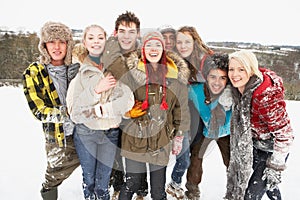 Teenage Friends Having Fun In Snowy Landscape