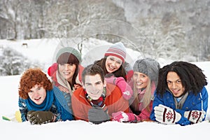 Teenage Friends Having Fun In Snowy Landscape