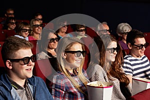 Teenage Friends Watching 3D Film In Cinema