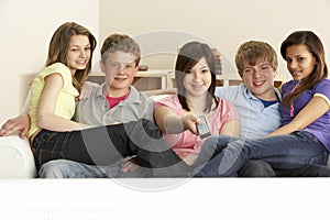 Teenage Friends Watching Television at Home