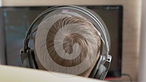 Teenage Gamer in Headphones, Sit in Armchair, Playing Video Games on Computer
